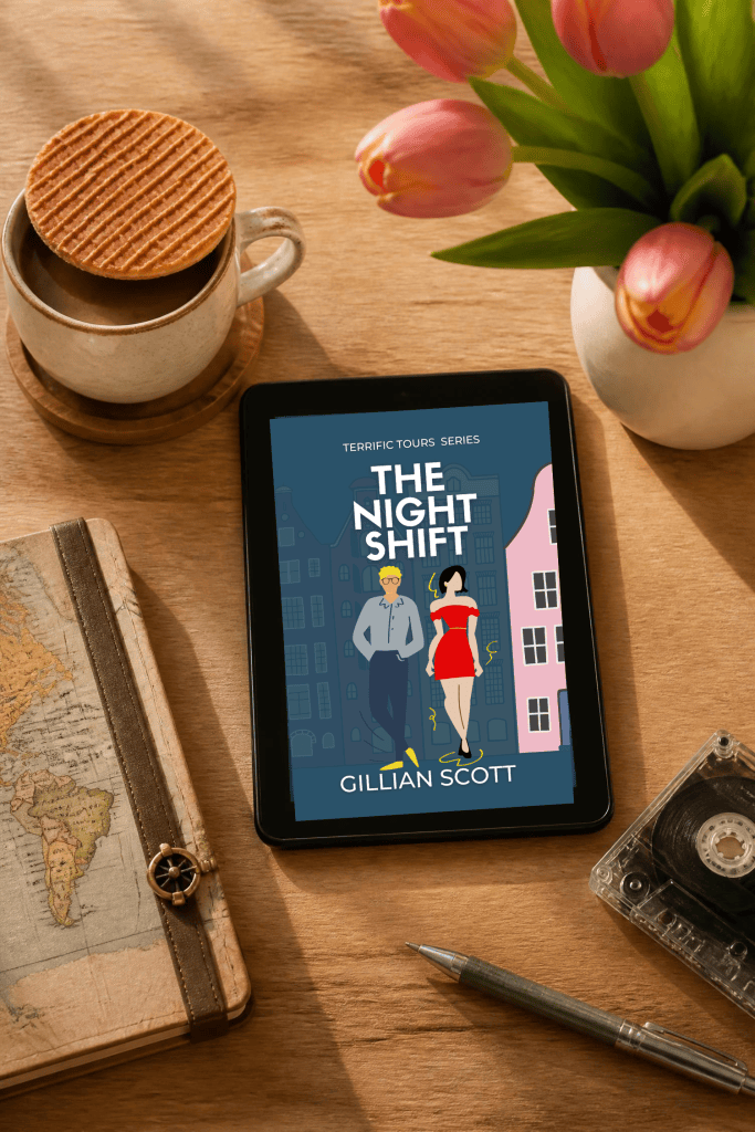A cup of coffee with a biscuit next to a tablet displaying the book 'The Night Shift' by Gillian Scott, placed on a wooden table with a map and a vintage tape recorder.